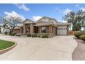 Beautiful brick home with a large driveway and attached garage at 1321 W Gardenia Ave, Phoenix, AZ 85021