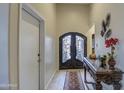 Elegant entryway showcasing a decorative front door, console table, and tiled flooring at 150 N Lakeview Blvd # 1, Chandler, AZ 85225