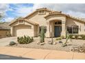 Attractive home with a well-maintained desert rock yard and mature cacti at 16388 N 99Th Pl, Scottsdale, AZ 85260