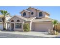 Charming two-story home featuring a unique architectural design and a well-maintained front yard at 18823 N 41St Dr, Glendale, AZ 85308