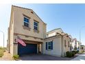 Charming stucco home with a covered driveway, a brick driveway, and an American flag at 285 E Raleigh Dr, Chandler, AZ 85286