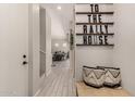 Inviting foyer featuring a decorative sign, tile floors, and views of the living spaces at 285 E Raleigh Dr, Chandler, AZ 85286