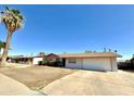 Traditional single-story home, bright exterior, attached two-car garage and desert landscaping at 3133 N 81St Ave, Phoenix, AZ 85033