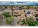 Beautiful aerial view of a two-story home featuring a well-manicured front yard and lengthy driveway at 3712 S 104Th Ln, Tolleson, AZ 85353