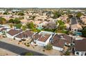 Overhead angle of a residential neighborhood displaying mature trees, sparkling pools and tree lined streets at 406 W Fellars Dr, Phoenix, AZ 85023