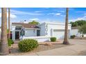 Charming single-story home with stucco exterior, desert landscaping, and a two-car garage at 406 W Fellars Dr, Phoenix, AZ 85023