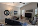 Stylish living room with vaulted ceilings, plantation shutters, and modern furnishings at 415 W Mohawk Ln, Phoenix, AZ 85027