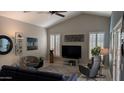 Stylish living room with vaulted ceilings, plantation shutters, and modern furnishings at 415 W Mohawk Ln, Phoenix, AZ 85027