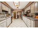 Bright kitchen features tile floors, stainless steel appliances, and plenty of counter space at 6217 W Orange Dr, Glendale, AZ 85301