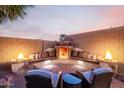 Inviting outdoor fire pit with comfortable seating, perfect for cozy evenings and relaxing at 1197 W Rolls Rd, San Tan Valley, AZ 85143