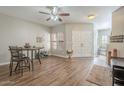 Inviting dining area with wood floors and a view into the living room at 12438 N Saguaro Blvd # 108, Fountain Hills, AZ 85268