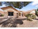 Attractive single-story home featuring a well-maintained yard with desert landscaping and a terracotta tile roof at 14218 W Via Montoya --, Sun City West, AZ 85375