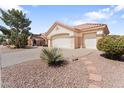 Charming home with a two-car garage and desert landscaping with a tiled roof at 14218 W Via Montoya --, Sun City West, AZ 85375