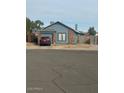 Single-story home with a garage, complemented by a well-kept front yard at 1608 W Curry Dr, Chandler, AZ 85224