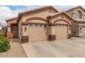 Inviting single-story home with a two-car garage and xeriscaped front yard at 2025 N 106Th Dr, Avondale, AZ 85392