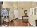 Elegant foyer with hardwood floors, high ceilings, and staircase leading to the upper level at 2280 E Aloe Pl, Chandler, AZ 85286