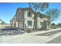 A two-story townhome featuring an attached garage and desert landscaping adding curb appeal to this inviting home at 2315 N 73Rd Dr, Phoenix, AZ 85035