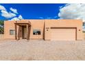 Single-story home with attached garage and xeriscape landscaping at 26015 S Grapefruit Dr, Queen Creek, AZ 85142