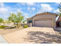 This well-manicured home features stone accents and desert-friendly landscaping and a paved driveway at 4121 W Bradshaw Creek Ln, New River, AZ 85087