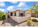 This lovely home features desert landscaping, a welcoming porch, and a two-car garage at 4121 W Bradshaw Creek Ln, New River, AZ 85087