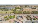 Aerial view of homes near a greenbelt and canal, some with pools at 41734 N Cielito Linda Way, San Tan Valley, AZ 85140
