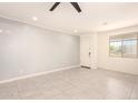 Bright, open living room with tile floors and natural light at 41734 N Cielito Linda Way, San Tan Valley, AZ 85140
