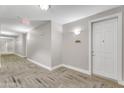 Elegant hallway with neutral walls, stylish flooring, and a glimpse of unit number 1419 at 5350 E Deer Valley Dr # 1419, Phoenix, AZ 85054