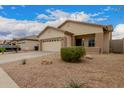 Inviting single-story home with desert landscaping and a spacious driveway at 606 S 124Th Ave, Avondale, AZ 85323