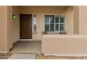 Cozy front porch featuring a sitting area and a view of the home's entry at 606 S 124Th Ave, Avondale, AZ 85323