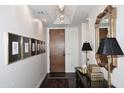 Foyer with dark wood floors, modern lighting, and elegant decor at 6166 N Scottsdale Rd # C4004, Paradise Valley, AZ 85253
