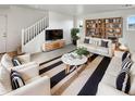 Bright living room with modern furnishings, stylish decor, and a cozy atmosphere at 7720 W Pipestone Pl, Phoenix, AZ 85035