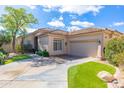 Charming single-story home with a desert landscape, tile roof, and two-car garage at 9475 N 115Th Pl, Scottsdale, AZ 85259