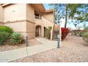 Inviting exterior view of a condo featuring private entry stairs at 9736 N 95Th St # 126, Scottsdale, AZ 85258