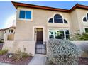 Charming two-story townhome boasts a gated entrance and meticulously maintained landscaping with a private patio at 10249 N 12Th Pl # 2, Phoenix, AZ 85020