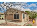 Charming single-story home featuring a two-car garage and low maintenance desert landscaping at 121 N Ramada --, Mesa, AZ 85205