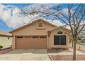 Charming single-story home with a two-car garage and low maintenance landscaping at 121 N Ramada --, Mesa, AZ 85205