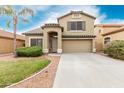 Inviting two-story home with desert landscaping, tile roof, and a spacious two car garage at 16543 W Ironwood St, Surprise, AZ 85388