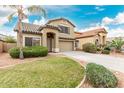 Inviting two-story home with desert landscaping, tile roof, and a spacious two car garage at 16543 W Ironwood St, Surprise, AZ 85388