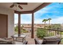 Cozy balcony with beautiful views of nearby landscaping, and outdoor furniture at 16616 E Gunsight Dr # 214, Fountain Hills, AZ 85268