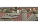 Close up of exterior architecture with tile roofs and desert landscaping at 16616 E Gunsight Dr # 214, Fountain Hills, AZ 85268