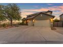 Beautiful home featuring desert landscaping and a spacious three-car garage at 18187 E Via Jardin --, Gold Canyon, AZ 85118