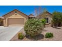 Charming single-story house with a two-car garage and desert landscaping at 19740 W Sherman St, Buckeye, AZ 85326