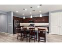 Spacious kitchen with granite countertops, a large island, and stainless steel appliances at 19740 W Sherman St, Buckeye, AZ 85326