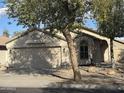 Charming single-story home featuring a two-car garage and xeriscaped front yard for easy maintenance at 20917 N 37Th Pl, Phoenix, AZ 85050