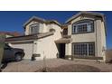 Two-story home showcasing desert landscaping and attractive architectural details at 22016 W Loma Linda Blvd, Buckeye, AZ 85326