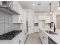 Spacious kitchen featuring stainless steel appliances, ample countertop space, and modern finishes at 24116 N 172Nd Ave, Surprise, AZ 85387