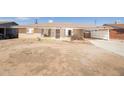 Single-story brick home with a covered carport featuring mature landscaping at 2808 W Ocotillo Rd, Phoenix, AZ 85017