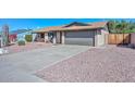 Street view of a single-story house, showcasing its brick exterior and low-maintenance desert landscaping at 3004 W Anderson Dr, Phoenix, AZ 85053