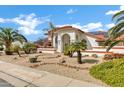 Front view of a well-maintained home featuring a terra cotta roof, stucco siding, and desert-style landscaping at 3522 E Fountain St, Mesa, AZ 85213