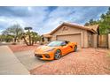 Single story home with desert landscaping, tile roof, and an attached two-car garage at 372 W Larona Ln, Tempe, AZ 85284